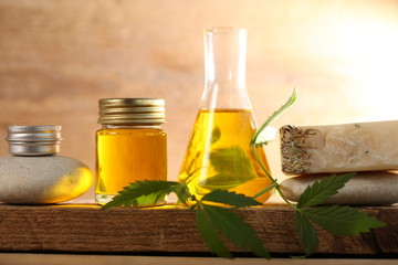 cbd oil bottle and hemp leaf . medical cannabis