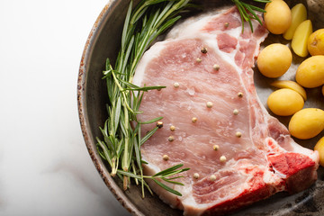 Uncooked pork meat on a pan 
