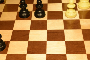 Wooden chess board with black pieces like a sport concept