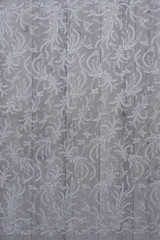 The texture of lace on wooden background