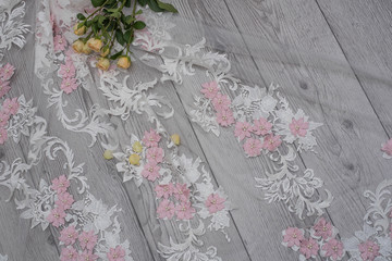 The texture of lace on wooden background