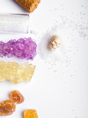 Sugar background. Different types of sugar with skull. Harm of eating sugar concept. Sweet leads to diabetes.