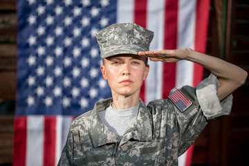Female US Army Soldier in front of usa flag