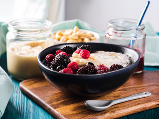 Chia pudding made with plant milk. Healthy breakfast with berries and nut butter.