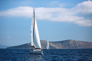 Fototapeta na wymiar Sailing luxury cruise yacht boats at the Aegean Sea, Greece.