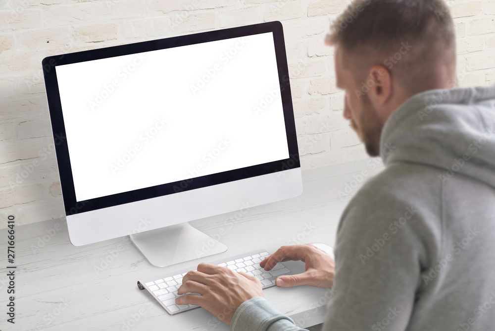 Fototapete Man work on computer concept. Isolated, white, blank screen on computer display for mockup.