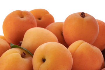 heap of fresh apricots isolated on white background