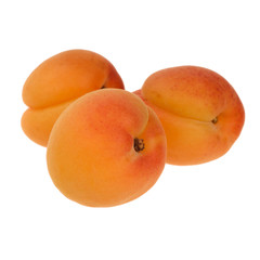 three of apricots isolated on white