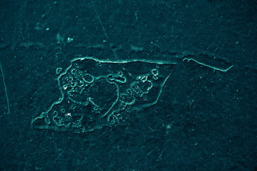 Vintage azure background. Rough painted wall of turquoise color. Imperfect plane of cyan colored. Uneven old decorative toned backdrop of aqzure tint. Texture of teal hue. Ornamental stony surface.