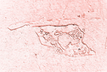 Vintage pink background. Rough painted wall of living coral color. Imperfect plane of beige colored. Uneven old decorative toned backdrop of beige tint. Texture of pink hue. Ornamental stony surface.