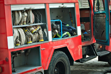 Demonstration of fire equipment at a school scientific exhibition. Open fire truck.