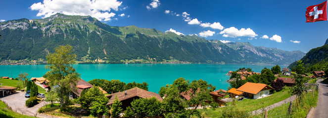 Swiss beauty, flag, Iseltwald at the lake Brienzersee, Switzerland, Europe