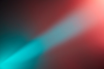 Light turquoise ray of light on a turquoise red and pink background