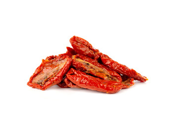 Dried tomatoes on a white background. Slices of dried tomatoes in oil close up.
