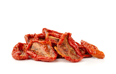 Dried tomatoes on a white background. Slices of dried tomatoes in oil close up.