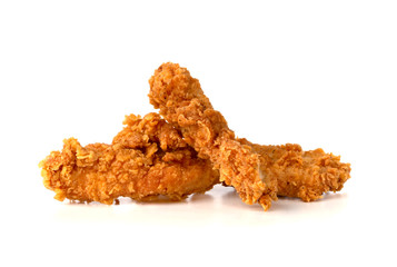 Fried chicken fillets on a white background. Fried chicken nuggets close-up.
