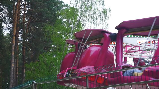 Rotating carousel in an amusement park.1920X1080 Full Hd.