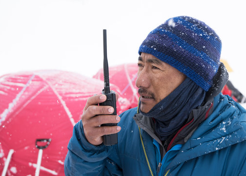 Nepal, Solo Khumbu, Everest, Ghurka using radio in Camp