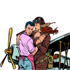 woman pilot says goodbye to a man, a couple in love with a retro plane © studiostoks