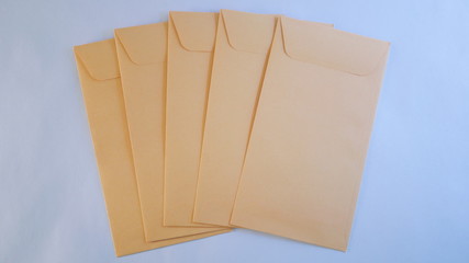 A neat stack of kraft cash envelopes laid out for budgeting, personal finance, or business uses.
