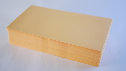 A neat stack of kraft cash envelopes for budgeting, personal finance, or business uses.