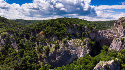 Aerial view of mountain and forest by the Vratna river in Serbia