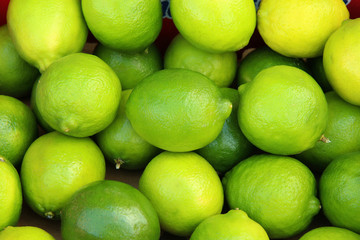 Fresh ripe limes on wooden table