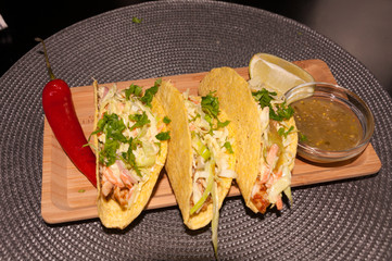 Mexican food. Delicious Tacos Honey Mustard Chicken with Cole Slow Salad and Salsa Verde Sauce