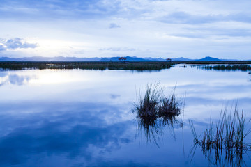A tranquil scenery of blue lake at dusk.