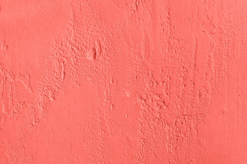 Trendy coral colored Concrete textured background with roughness and irregularities to your concept or product.