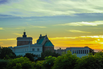 Lublin castle at sunset next to colorful gradient clouds