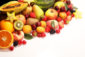Fresh summer fruits with apple, peach, papaya, berries, pear and apricot.