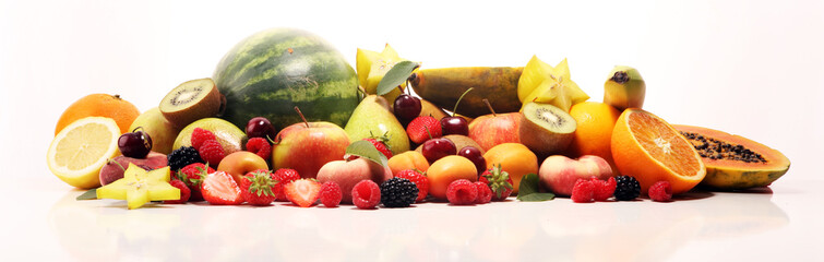 Fresh summer fruits with apple, peach, papaya, berries, pear and apricot.