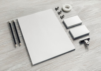 Blank stationery set on light wood table background. Corporate identity template. Responsive design...