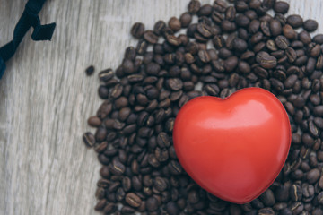 cup of coffee and heart on a red background