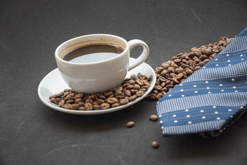 cup of coffee and beans with necktite