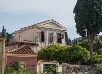 Fototapeta na wymiar ATHENS, GREECE - 14 May 2019: House with statue in ancient neighborhood of Plaka in Athens by the Acropolis