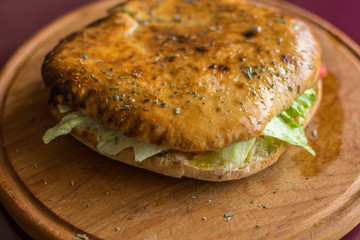 Panini, toasted bread with fresh vegetables and meat.