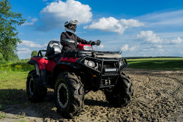 Outdoor activity. Quad bike rides. Extreme sport. Nature, forest, river.