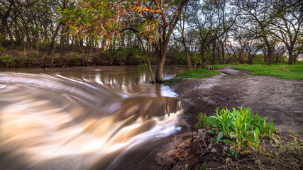 Hays, KS USA - Muddy Waters of the Big Creek in after Spring Floods