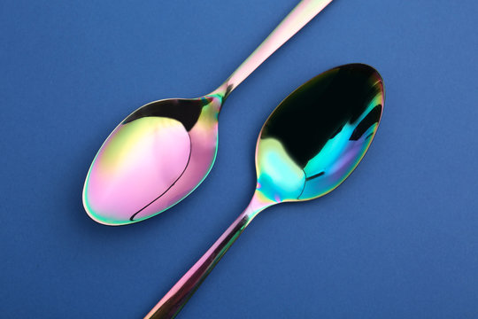 Clean tablespoons on color background, flat lay