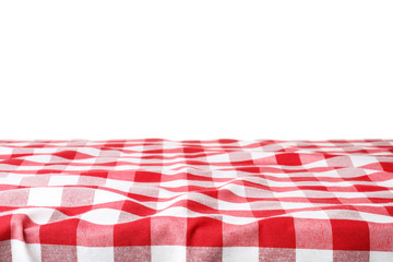 Table with red checkered cloth isolated on white