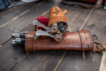 Set of three throwing axes in leather sheath