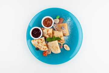 Crepes with jam and dried fruit