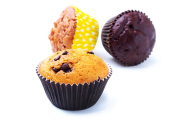 Assorted with Delicious homemade cupcakes with raisins and chocolate isolated on white background. Muffins. Top view.