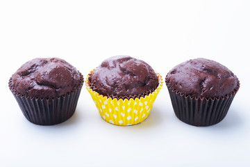 Assorted with Delicious homemade cupcakes with raisins and chocolate isolated on white background. Muffins. Top view. Copy space.