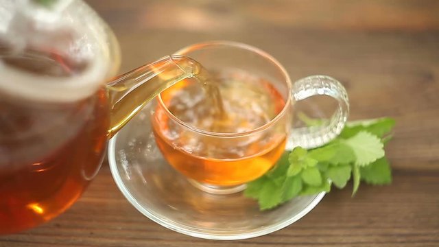 delicious green tea in a beautiful glass bowl on table