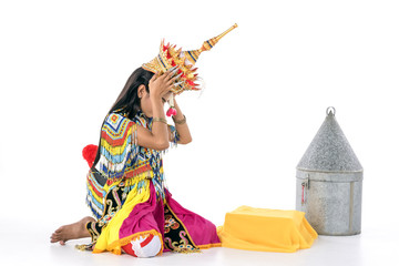 Asian woman in traditional costume of Southern Thailand. Nora dance show.sit and decorate body before show time.