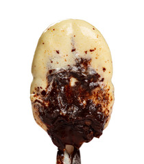 chocolate outer popsicle with the outer half melted on a white background