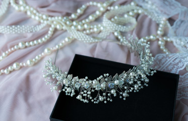 Wedding background with pearls and hair accessories on pink background